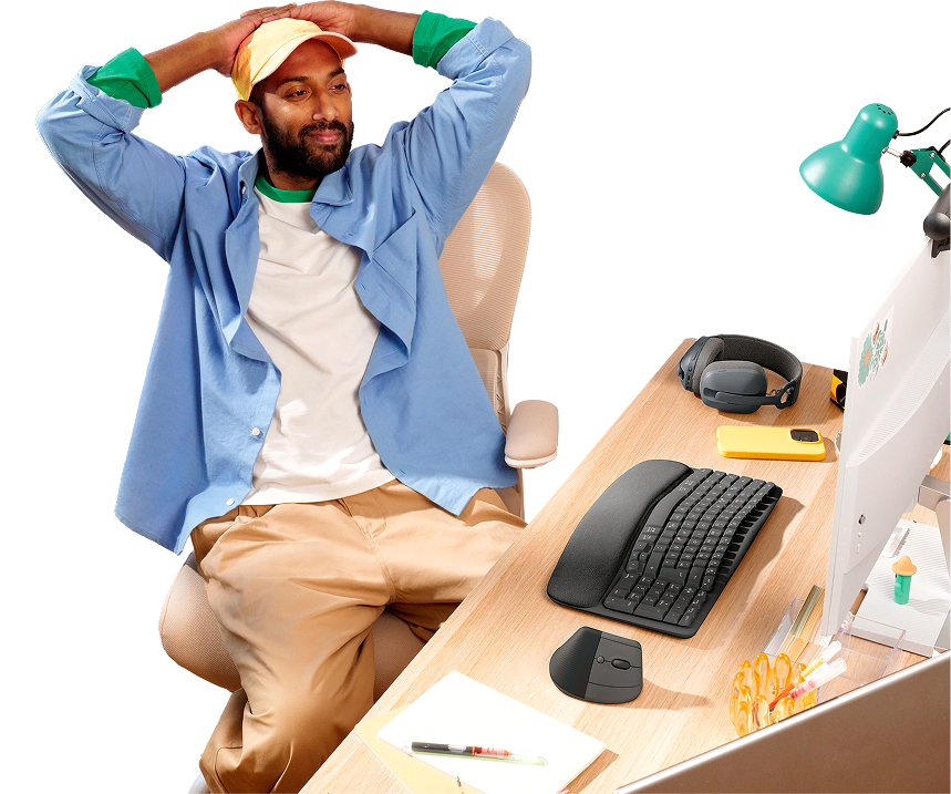 Man relaxing at a desk equipped with Logitech products